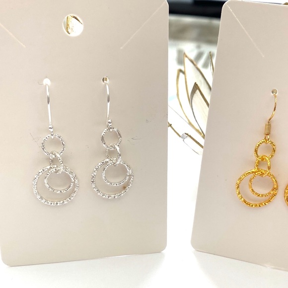 Silver and gold sparkly dangle earrings. - Picture 1 of 2